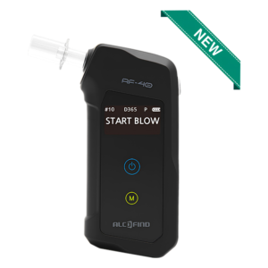 Close-up of a black handheld device with a digital screen reading 'START BLOW', blue power ring, and ALCOFIND branding; a clear nozzle is visible on the left.